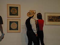 Cowboy and lady-friend in gallery